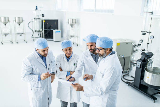 istock Team of scientists examining research data in laboratory. 1340654609