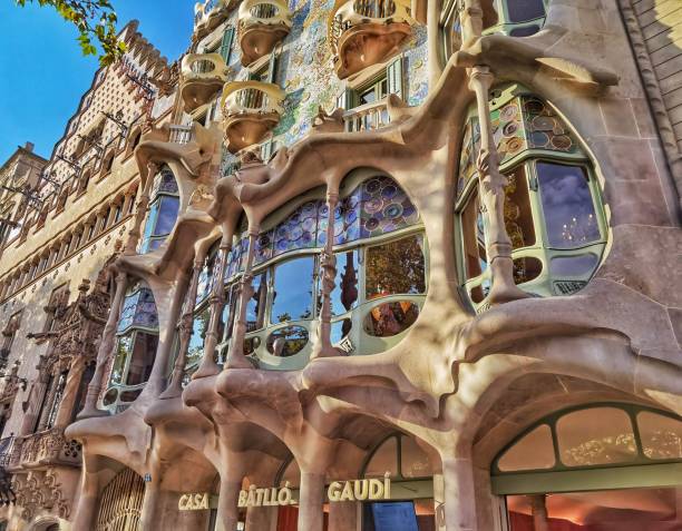 Low angle view of Casa Batllo building architecture by Antoni Gaudi in Barcelona, Catalonia, Spain, Europe September 16, 2021 - Barcelona, Spain: Low angle view of Casa Batllo building architecture by Antoni Gaudi in Barcelona, Catalonia, Spain, Europe antoni gaudí stock pictures, royalty-free photos & images