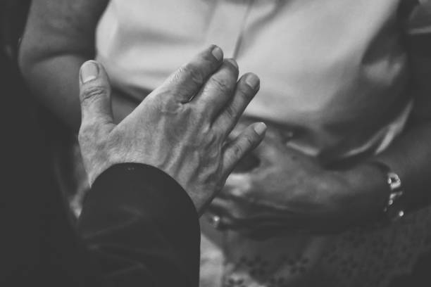 istock People praying together at church. 1340657079
