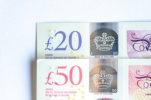 Macro close-up of new UK £20 and £50 notes,  the new £50 note came into circulation 23 June 2021.