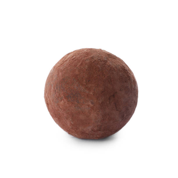 istock Delicious chocolate truffle candy isolated on white 1340657842