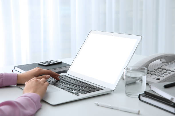 istock Young woman using modern computer at table indoors, closeup. Space for design 1340661062