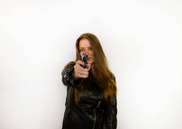 young beautiful woman with a gun