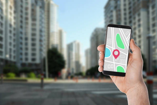 istock Man searching location with smartphone in city, closeup. Space for text 1340662066