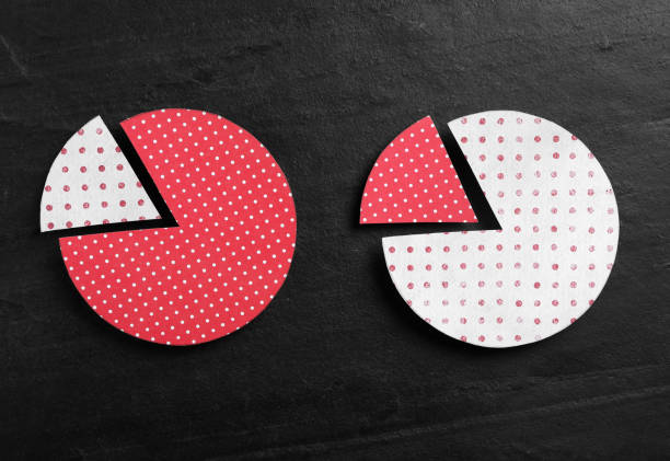 Paper circles with exchanged segments on black slate background, flat lay. Pareto principle concept