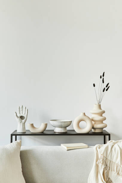 istock Stylish and cozy living room interior design composition with copy space, corner sofa, coffee table, textile and personal accessories. Scandinavian classic style. 1340662431