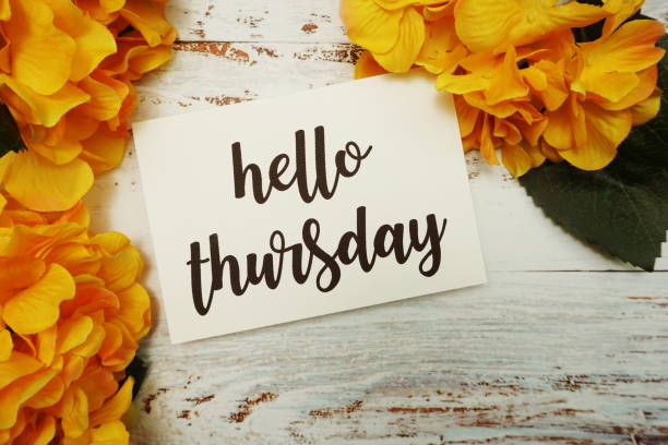 istock Hello Thursday Card with Blooming flower on wooden background 1340663504