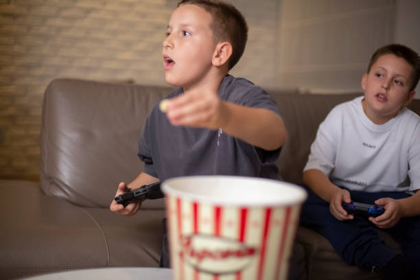 istock Mother and son playing nintendo games at home 1340664795