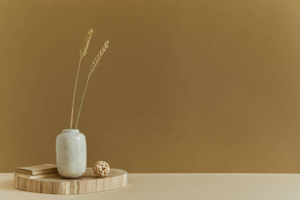 istock Creative composition of minimalistic interior design with copy space, natural materials as wood and marble, dry plants and personal accessories. Neutral and yellow colours, template. 1340665295