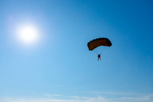 istock Parachute on the blue sky 1340667057