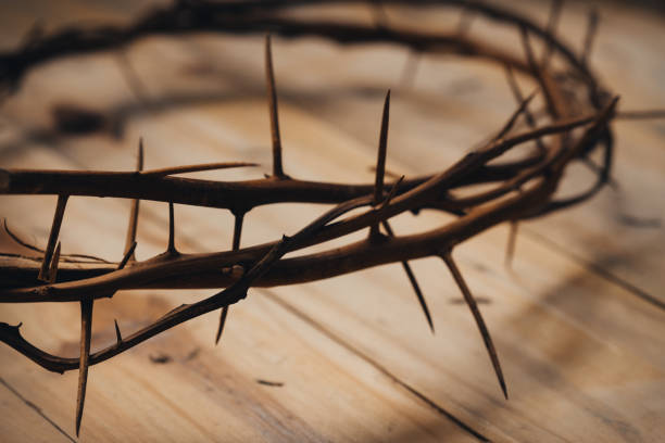 istock Crown on thorns on wooden background. 1340667315