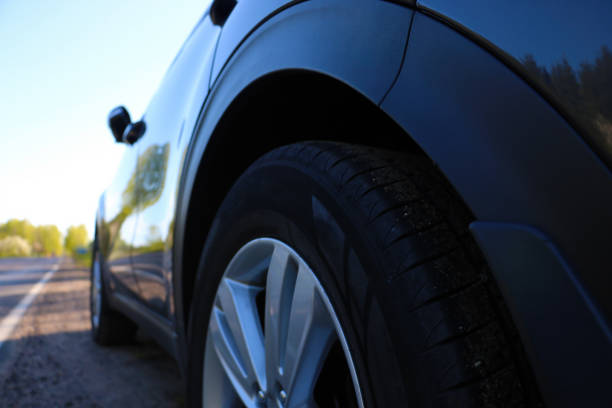 istock Bottom view of a parked car along the road. 1340670123