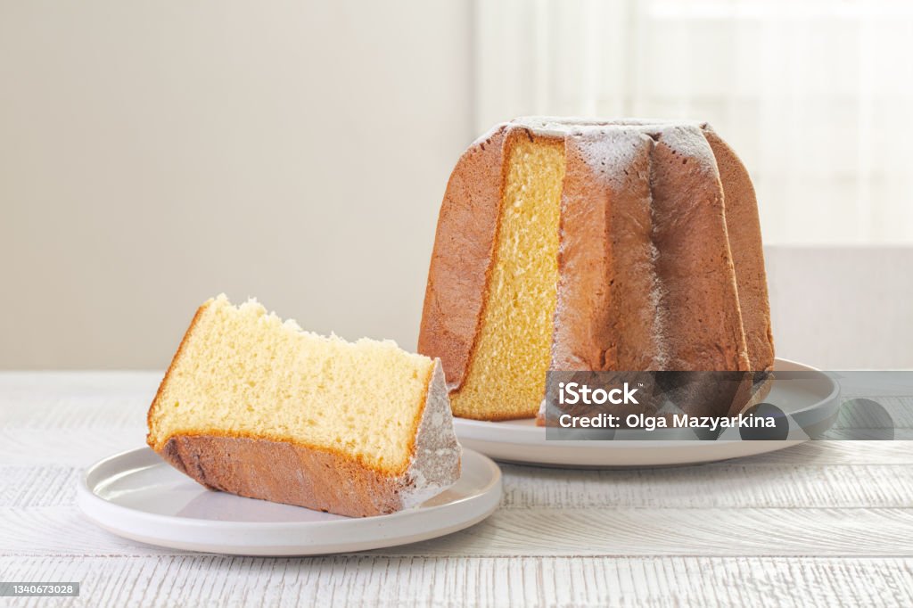 Pandoro -  traditional Italian sweet bread, dusted with vanilla-scented icing sugar. Light background, copy space. Pandoro Stock Photo