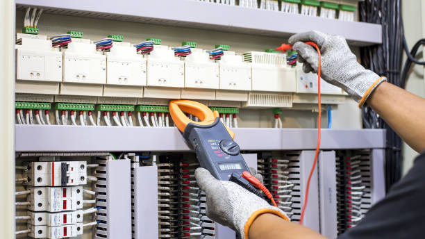 istock Electrical engineer tests the operation of the electric control cabinet on a regular basis for maintenance. 1340673746