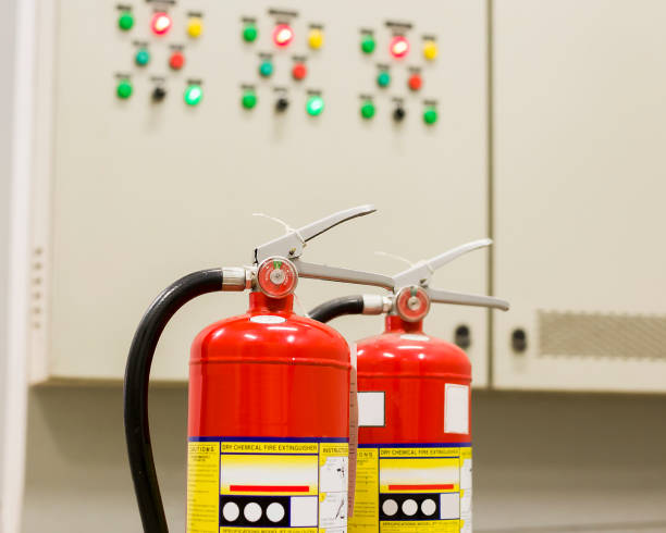 istock The red fire extinguisher is ready for use in case of an indoor fire emergency. 1340673809