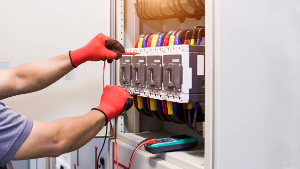 istock Electrical engineer tests the operation of the electric control cabinet on a regular basis for maintenance. 1340673901