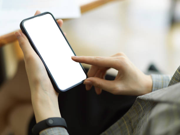 istock Businesswoman using mobile phone at office 1340674152