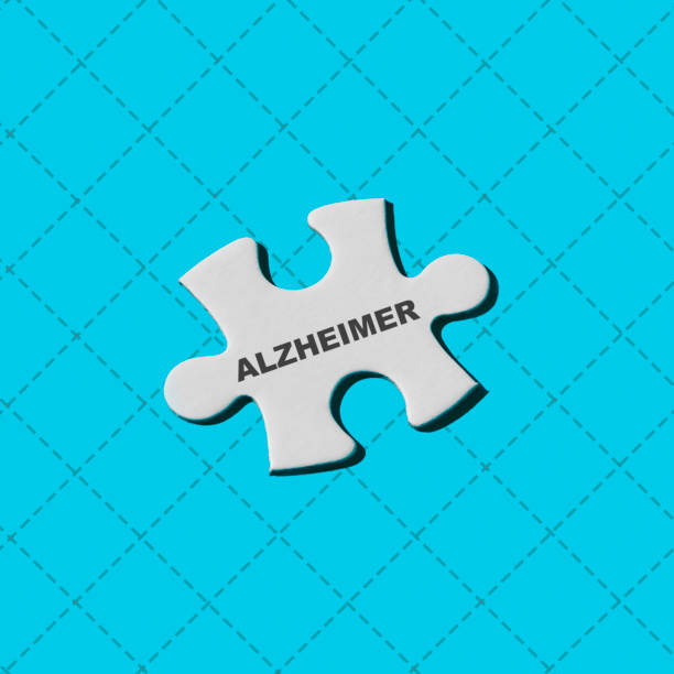 istock white puzzle piece with the word alzheimer 1340675102