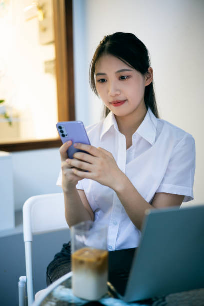 istock Businesswoman communicat work content with mobile phone 1340677057