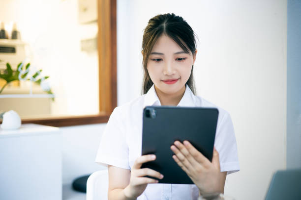 istock Young businesswoman working with digital tablet 1340677113