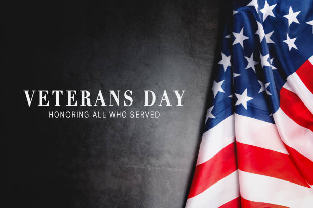 istock Veterans day. Honoring all who served. American flag on gray background with copy space. 1340680982