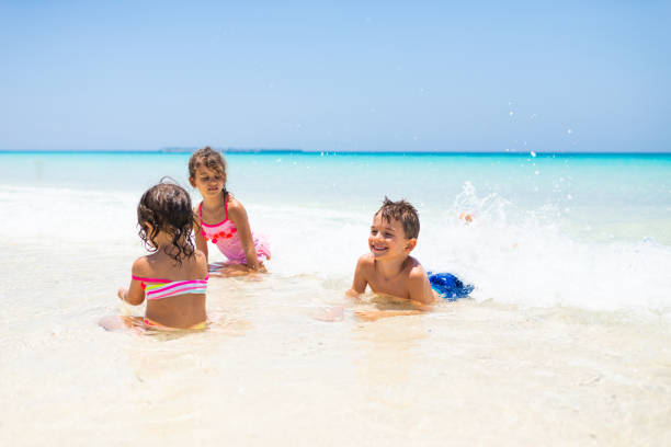 istock Children relaxing at the beach 1340682025