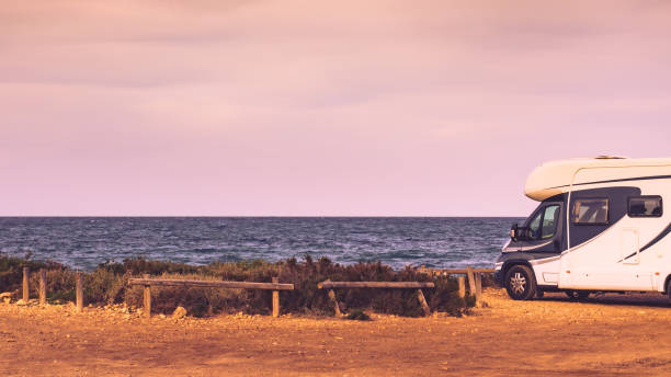 istock Camper car on beach, camping on nature 1340685082
