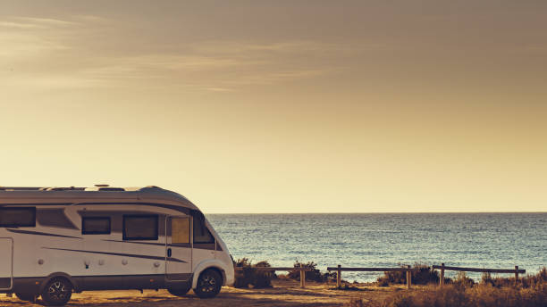 istock Camper car on beach, camping on nature 1340685268