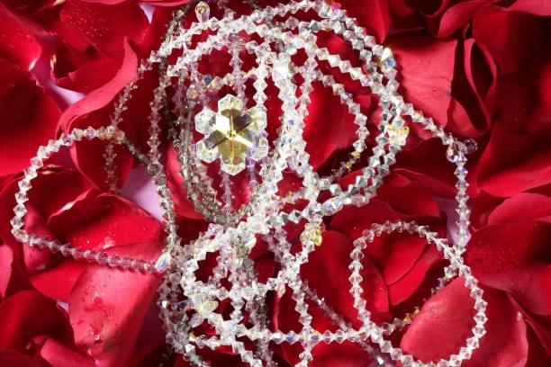 istock Shiny jewelry over red rose petals 1340686406