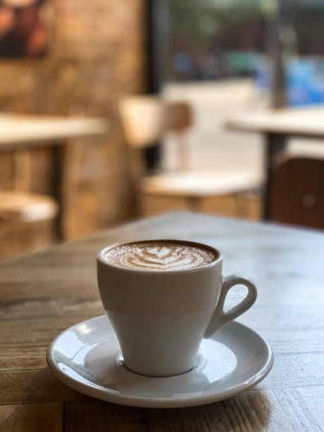 istock Woman is drinking latte art coffee 1340688070