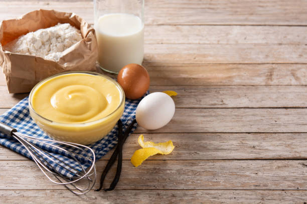 istock Pastry cream in a bowl and ingredients 1340688393