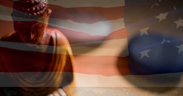 istock Composition of buddha figure over american flag 1340688720