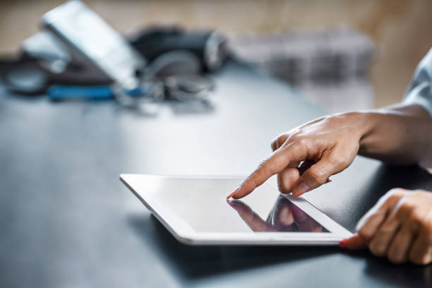 istock medical doctor woman smile hold tablet pc, using computer. 1340689623