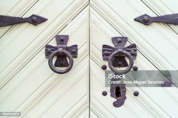 White Wooden Door With Lock And Black Metal Hardware Stock Photo - Download Image Now