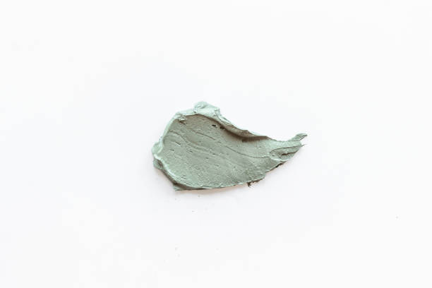 istock Texture of cosmetic clay mask isolated on white 1340693276