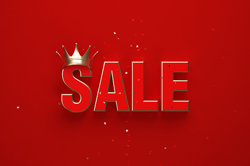 The word sale wearing gold crown on red background. Horizontal composition with clipping path and copy space. Sale concept.
