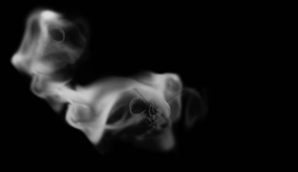 Scary skull emerging from a cloud of smoke.3D rendering stock photo