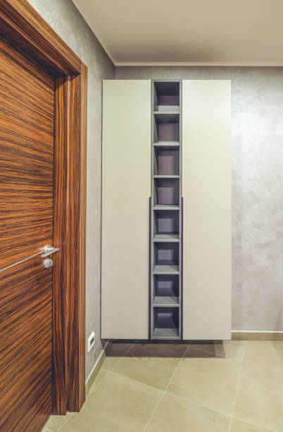 istock Modern interior. Wooden door. Empty shelves. 1340695340
