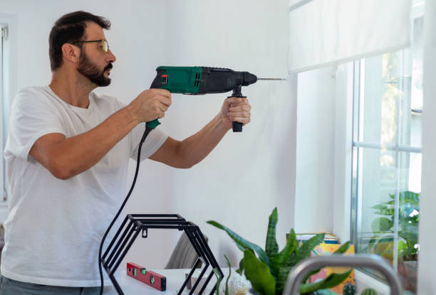 istock A mature man set up a wall shelf in his kitchen 1340699710