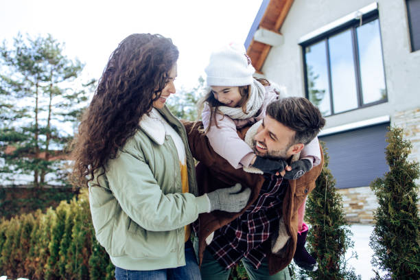 istock Young family having fun on a winter vacation 1340700640