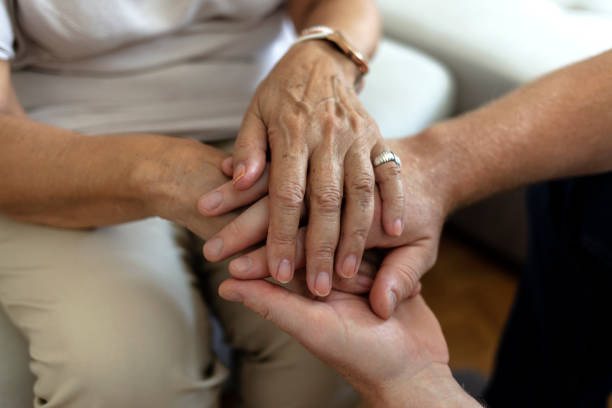 istock A cropped shot of a man holding a loved one's hand in support. 1340701821