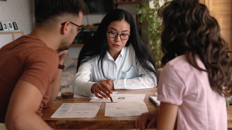 Young couple getting advice from professional financial expert