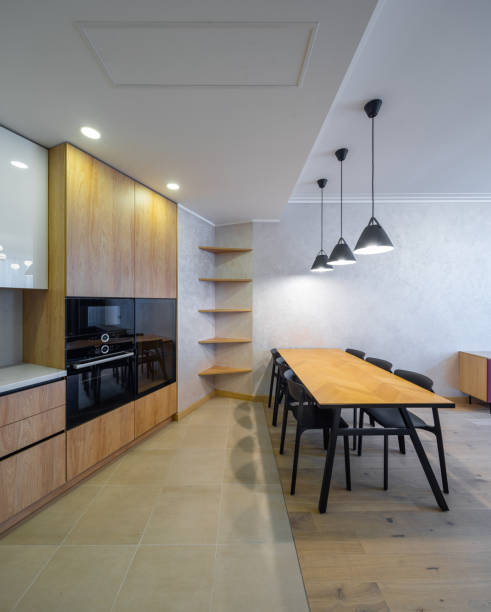 istock Modern interior of spacious light wooden kitchen in apartment. 1340702587