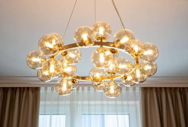 istock Modern designed chandelier with round burning lamps. 1340702593