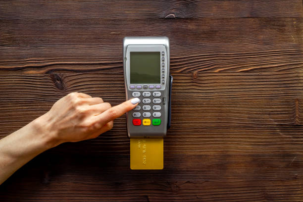 istock Hand paying by card with pos payment terminal. Payment transactions concept 1340702863