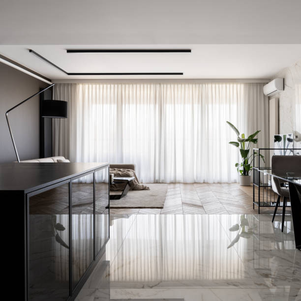 istock Apartment with big windows behind white curtains 1340705137