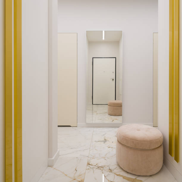 Elegant apartment corridor in white and gold with big mirror, luxury marble floor tiles and stylish beige, round seat