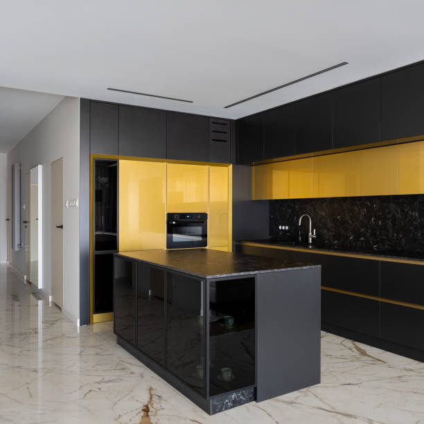 istock Spacious and luxury black and gold kitchen 1340705154