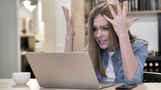 istock Angry Creative Woman feeling upset while Reacting to Loss 1340705409
