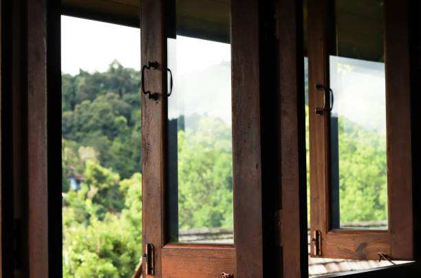 istock Dark brown wooden window. 1340705452